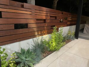 A modern wood slat fence complementing the landscaping, installed by Los Angeles Fence Builders in Los Angeles, CA.