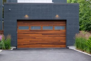 A modern wooden-look garage door with horizontal windows, installed by Max Garage Door in Minneapolis, MN.
