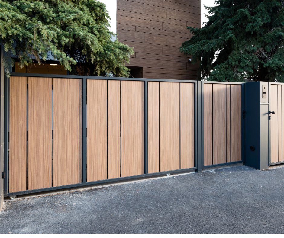A modern wooden and metal sliding driveway gate, installed by Coastline Gate Repair in Los Angeles, CA.