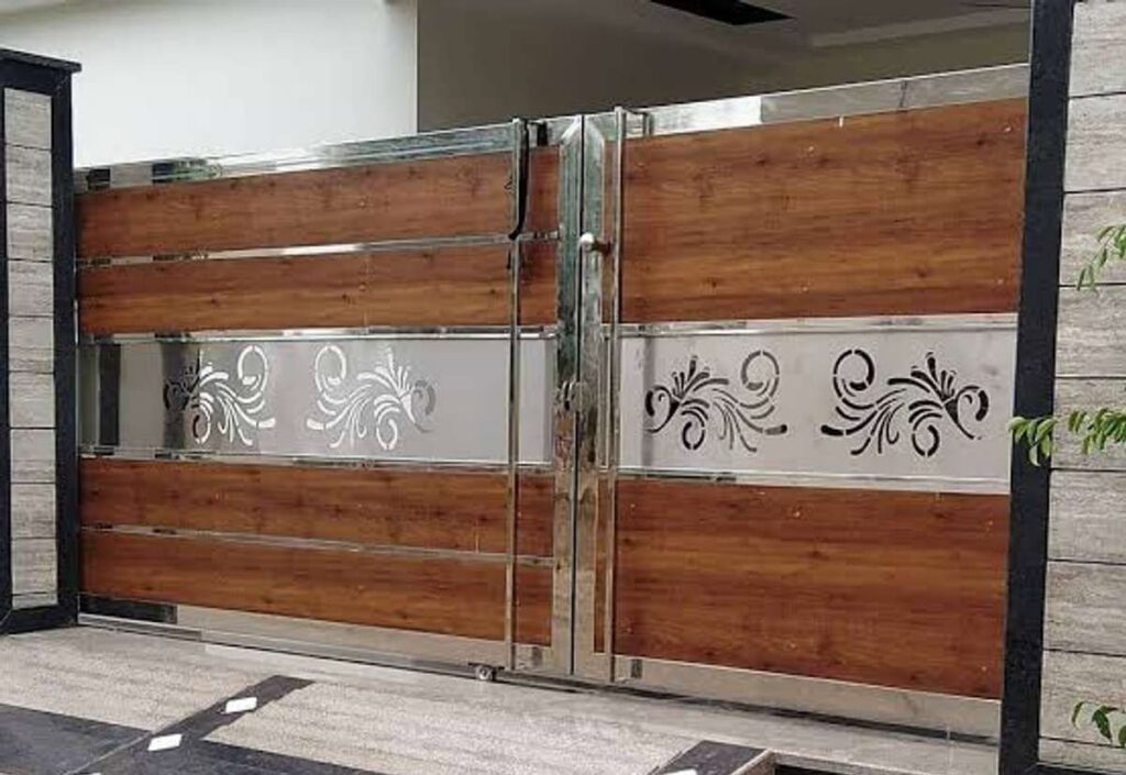 A modern wooden and stainless steel driveway gate with decorative cutouts, installed by Coastline Gate Repair in Los Angeles, CA.