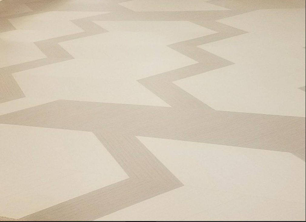 A modern zigzag pattern carpet installation, demonstrating unique design work by Flooring Authority, Inc. in Amsterdam, NY.