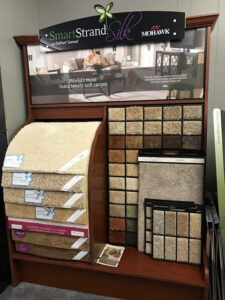 A display featuring Mohawk SmartStrand Silk carpet samples in the showroom of BK The Floor Store of Nebraska in Columbus, NE.