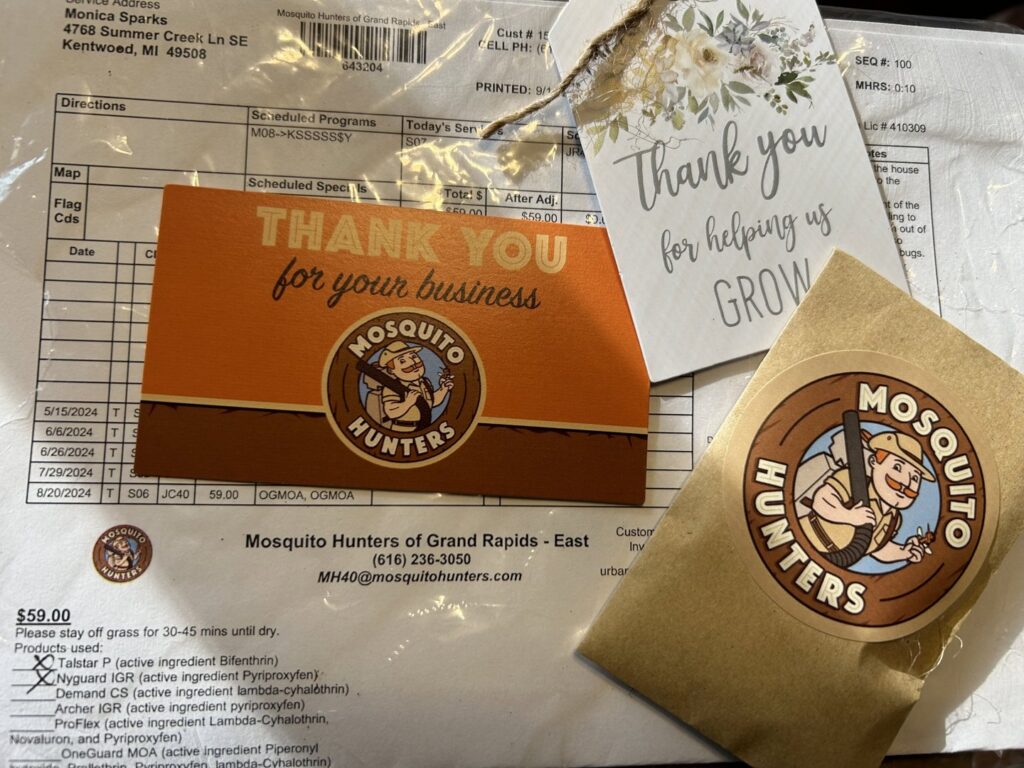 A detailed service invoice from Mosquito Hunters of Grand Rapids, MI, showing pest control treatments and products used.