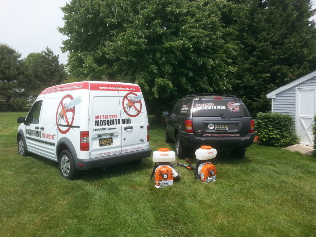 Mosquito Mob service vehicles and backpack sprayers ready for pest control work in Wilmington, DE.