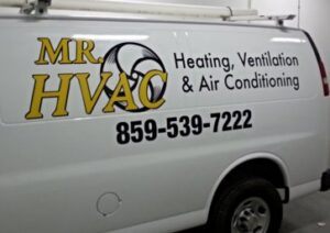 A close-up of the side of a Mr. HVAC branded service van, displaying heating, ventilation, and air conditioning services in Lexington, KY.