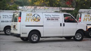 A white Mr. HVAC service van with ladders on the roof, ready for heating and cooling jobs in Lexington, KY.