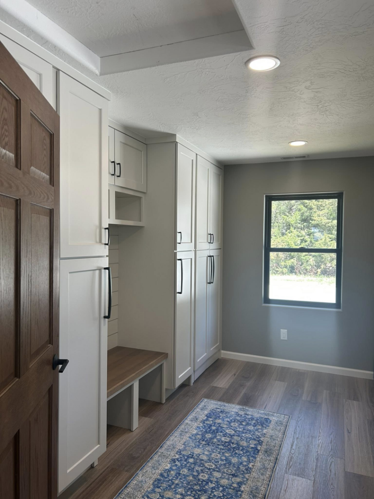 Bright mudroom or entryway featuring recessed ceiling lights installed by Highmark Electric in Kearney, NE.