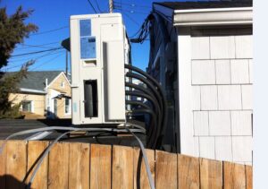 An outdoor multi-split air conditioning unit installed on a roof by Accurate Conditioning in Sayreville, NJ.