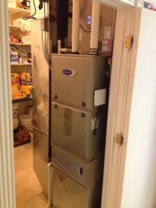 A multi-stage Carrier HVAC system installed in a utility closet by D &Sons Heating and Cooling LLC in Schenectady, NY
