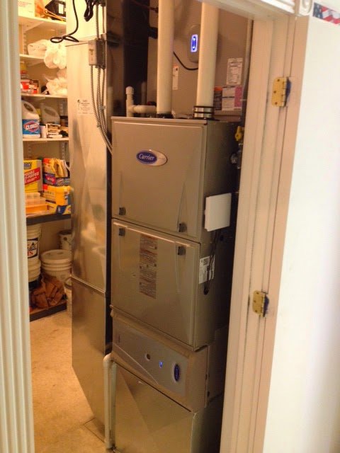 A multi-stage Carrier HVAC system installed in a utility closet by D &Sons Heating and Cooling LLC in Schenectady, NY