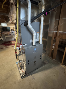 A multi-stage furnace or air handler unit with extensive ductwork and piping installed by Vai Services in Wilmington, DE.