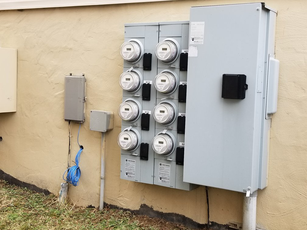 A multi-unit electric meter installation on the exterior of a building by Cargo Electric LLC in Pittsburgh, PA