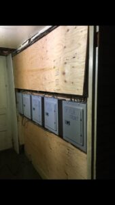 Multi-unit electrical panel installation with labeled boxes by John Fean Electrician Inc. in Philadelphia, PA.