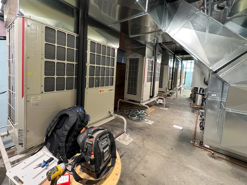 Multiple commercial HVAC units and ductwork installed by Air Masters HVAC Services of New England, Inc. in Fall River, MA.