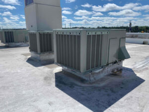 Multiple commercial HVAC units installed on a large rooftop by SBS-NC, LLC in High Point, NC