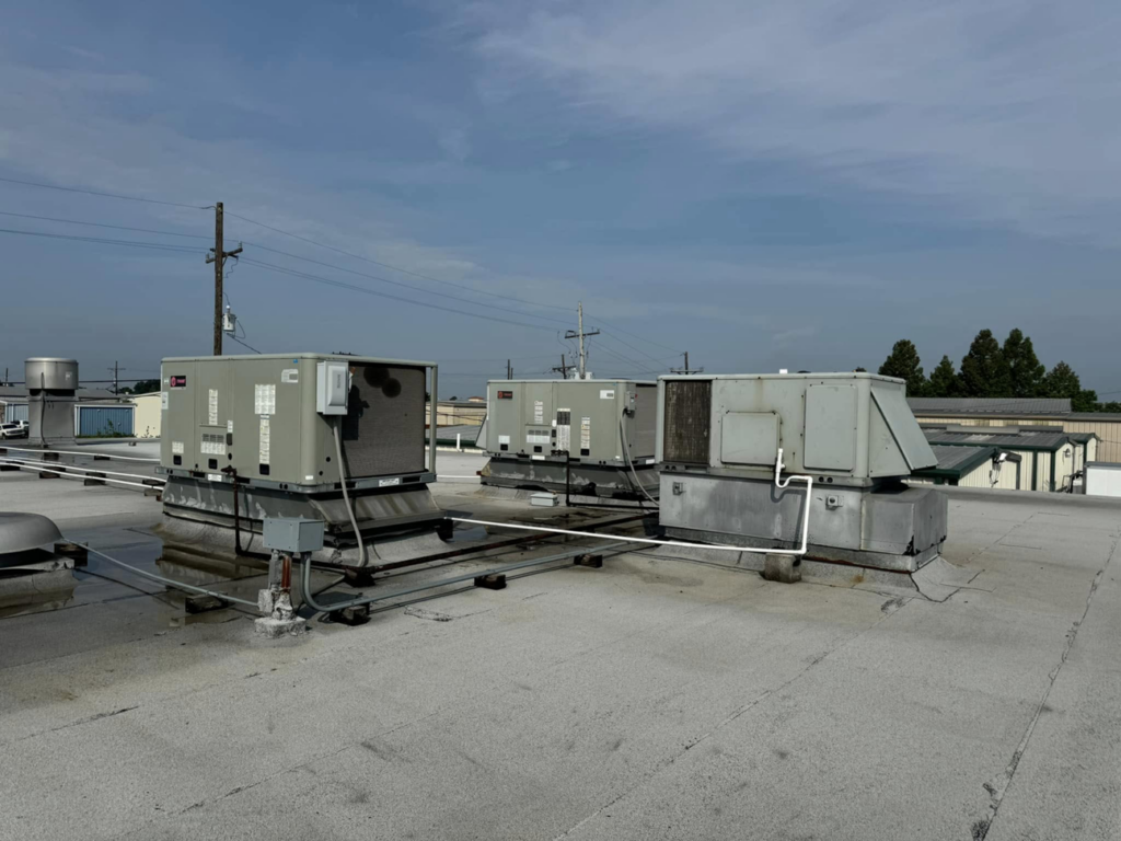 Multiple commercial rooftop HVAC systems maintained by Air Control Heating & Air in Central City, LA