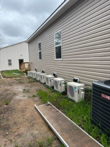 Multiple Daikin mini-split HVAC units installed along the side of a building by SJ Conner and Sons Inc in Roanoke, VA