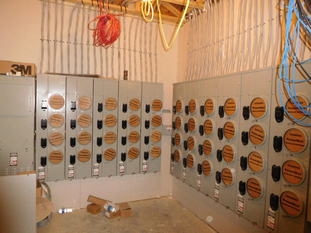 A wall of multiple Siemens electrical meter panels installed by Bonham Electric, Inc. in Sacramento, CA.
