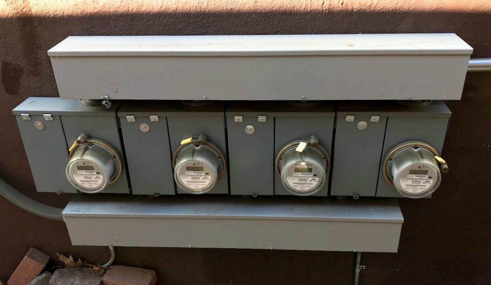 Installation of multiple electrical meters on an exterior wall by Olectric in Reno, NV.