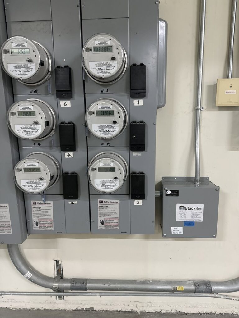 Multiple electrical meters and a BlackBox unit installed on a wall by Thee electrician in San Francisco, CA