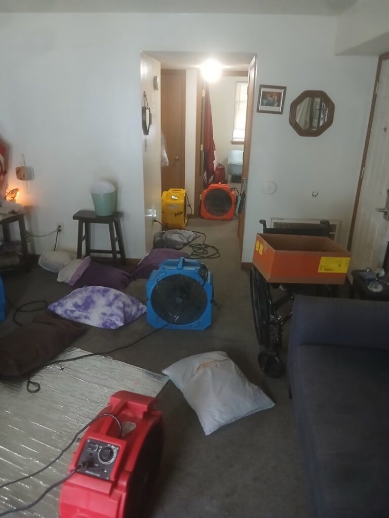 Multiple fans and heaters set up in a room for pest control heat treatment by All Seasons Pest Control LLC in Topeka, KS.