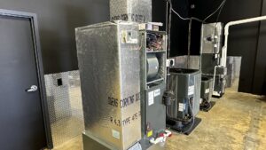 A row of various HVAC furnace and air handler units, showcasing the range of systems handled by Prime Home HVAC in York, PA.