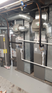 Multiple new HVAC furnaces, air handlers, and water heaters installed with ductwork by WC Heating & Cooling Corp. in West Chicago, IL.