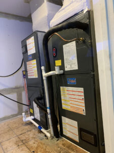 Multiple indoor air handler units installed in a utility space by Netherland Air Conditioning LLC, providing HVAC services in Mobile, AL.