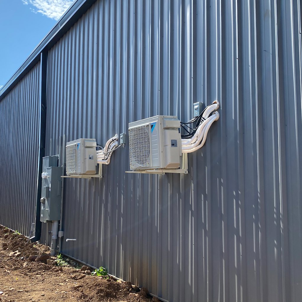 Multiple mini-split outdoor units installed on a commercial building by Southern Comfort Heating & Cooling in Lexington, KY