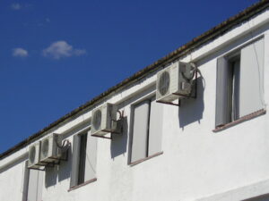 Multiple mini-split outdoor HVAC units installed on the side of a commercial building by Trenary Service Company in Martinsburg, WV.