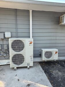 Multiple Mitsubishi Electric outdoor HVAC units installed side-by-side by KO HVAC Heating & Cooling in Kingston, PA.