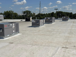 Multiple new commercial rooftop HVAC units installed by Air Conditioning Experts in Orlando, FL.