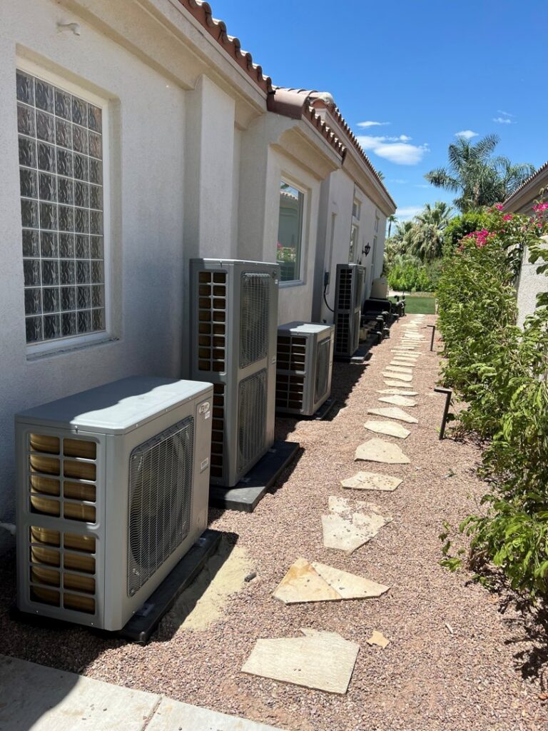 Multiple outdoor AC condenser units installed along a building by 20th Century Heating and Air in Anaheim, CA.
