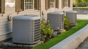 Multiple outdoor AC condenser units installed outside a building by Emerald Air in Wichita, KS.