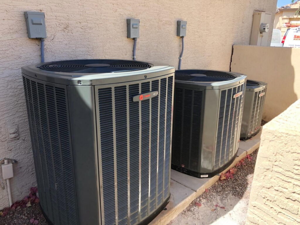 Three outdoor air conditioning condenser units installed by Sun Devil Heating & Cooling INC in Peoria, AZ.