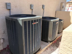 Three outdoor air conditioning condenser units installed by Sun Devil Heating & Cooling INC in Peoria, AZ.