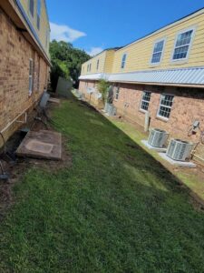 Multiple outdoor air conditioning units installed for a commercial building by Zippers Heating and Cooling in Mobile, AL.