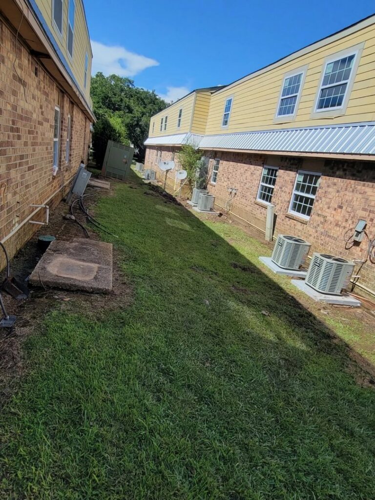 Multiple outdoor air conditioning units installed for a commercial building by Zippers Heating and Cooling in Mobile, AL.