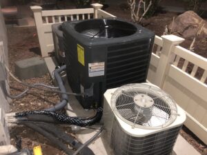 Multiple outdoor AC units, including a new installation, by Mechanical Express in Henderson, NV.