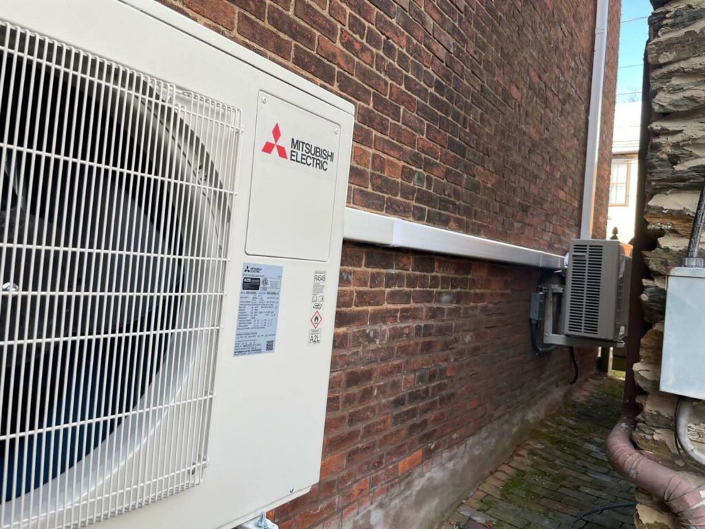 Multiple outdoor AC units installed along the side of a residential property by Trusted HVAC in Martinsburg, WV