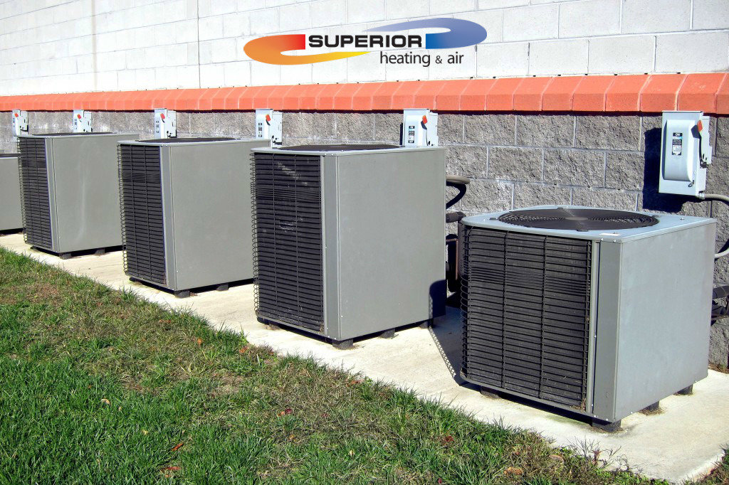Multiple outdoor air conditioning units installed by Superior Heating & Air in Harvest, AL.