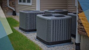 Multiple outdoor HVAC condenser units installed next to a residential building by Ault's Cooling HVAC Services LLC in Chandler, AZ.