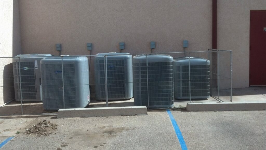 Multiple outdoor HVAC units installed for a commercial property by Anderson Refrigeration, Inc. in Poplar Grove, IL.