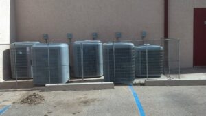 Multiple outdoor HVAC units installed for a commercial property by Anderson Refrigeration, Inc. in Poplar Grove, IL.