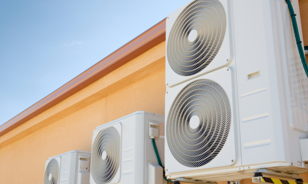 Multiple outdoor mini-split air conditioning units installed on a commercial building by R&R Mechanical Services in Greeley, CO.