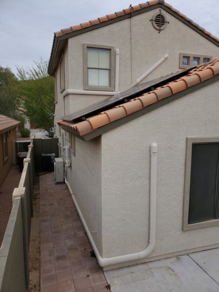 Multiple outdoor mini-split air conditioning units installed along a house by Pacheco Air Conditioning and Heating LLC in Albuquerque, NM.