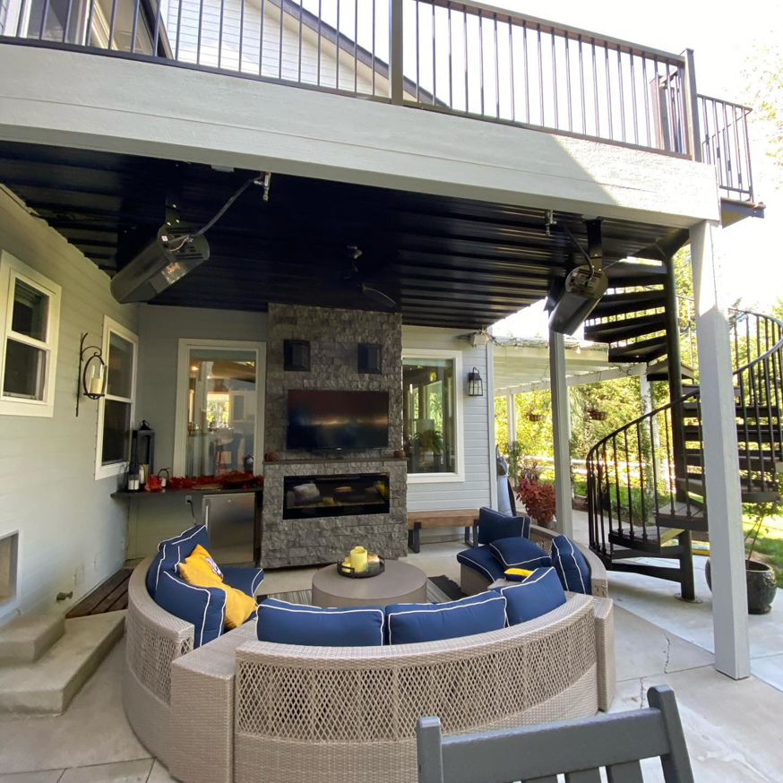 Multiple outdoor radiant heaters installed under a deck on a patio by Mech-Masters, Inc. in Nampa, ID.