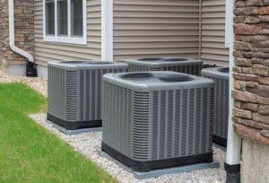 Multiple residential air conditioning units installed outside a home by Accurate HVAC in Vacaville, CA.
