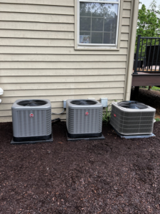 Three Rheem outdoor AC condenser units installed by Kai's Heat & Cool in Naperville, IL