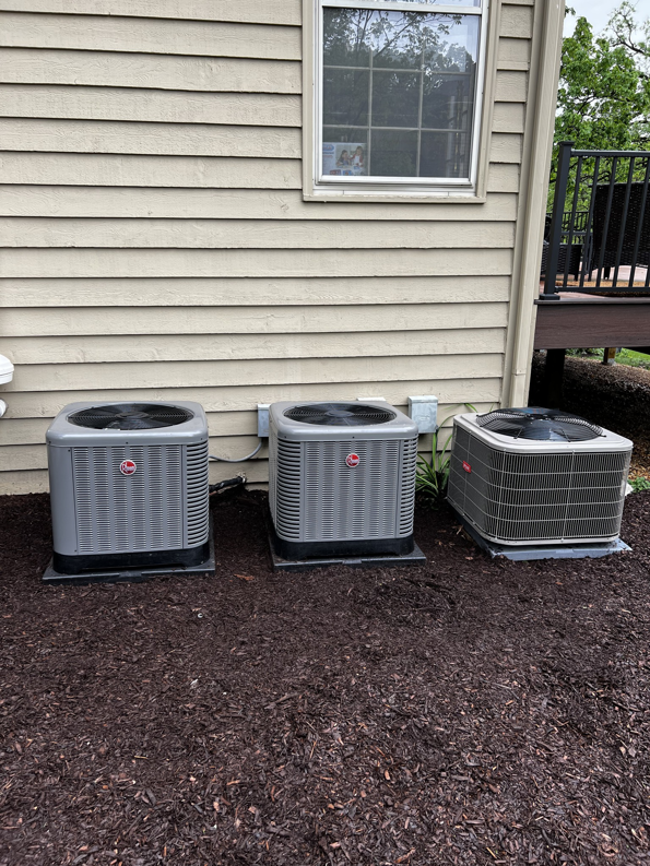 Three Rheem outdoor AC condenser units installed by Kai's Heat & Cool in Naperville, IL